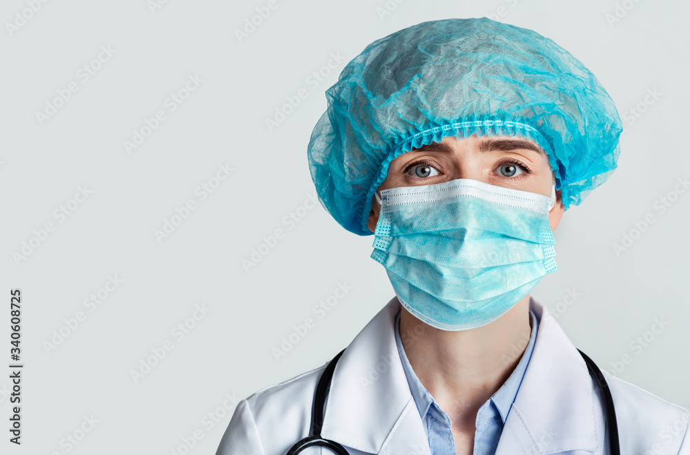 Therapist in protective mask and cap with stethoscope Therapist in protective mask and cap with stethoscope