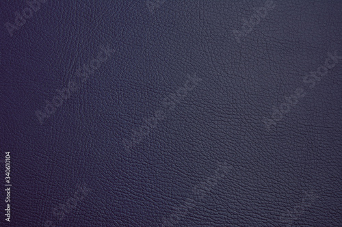 Blue old dermatin. Dark faux leather. Close-up. Background. Texture. photo