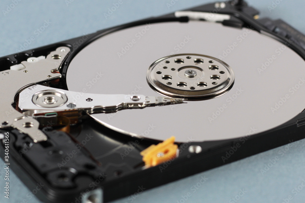 Elements of the inside of a computer hard drive. Side view. Blue background. Elements of the inside of a computer hard drive. Side view. Blue background.