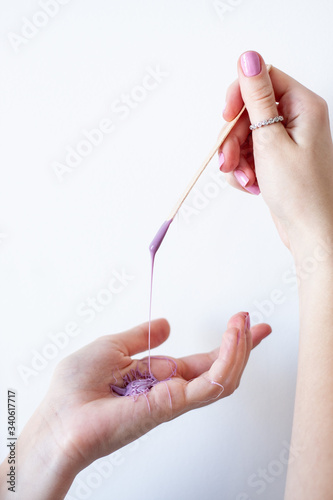 woman s hands with wax