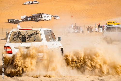 off road vehicle drifting in Liwa desert in Moreeb dunes motor festival photo