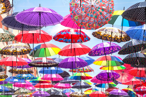 Photography colorful umbrella roof between buildings in a shopping center