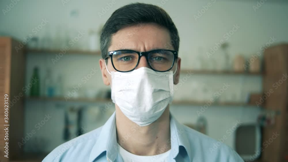 Face of a man in glasses and a protection mask in a close up. Portrait. Face of a man in glasses and a protection mask in a close up. Portrait.