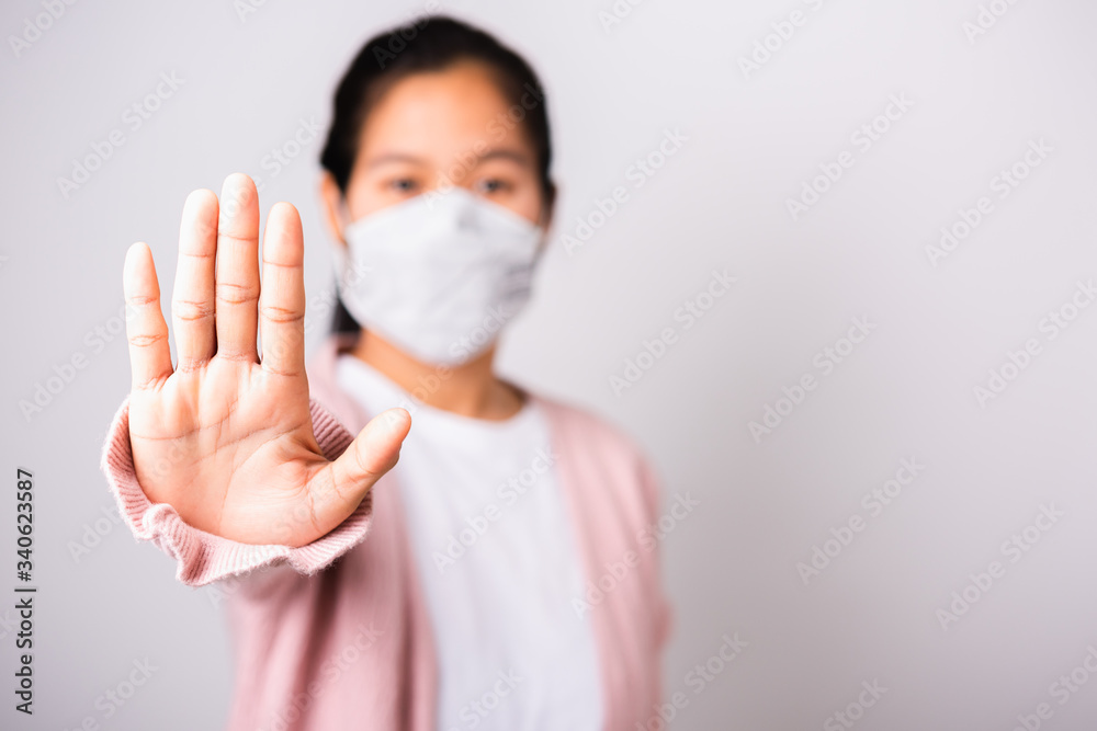 woman wearing surgical protection face mask hygiene against coronavirus her raising hand stop sign woman wearing surgical protection face mask hygiene against coronavirus her raising hand stop sign