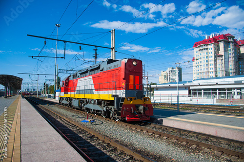 The locomotive of the train arrives at the station
