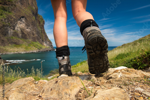 female hiker shoes walking towards water