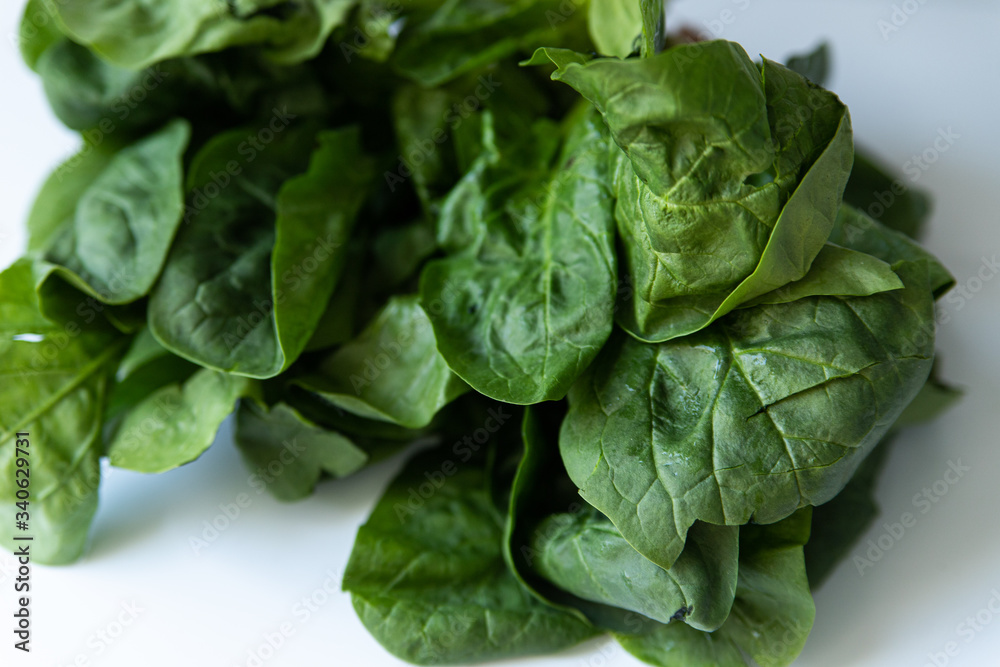 Bunch of green spinach on white background Bunch of green spinach on white background