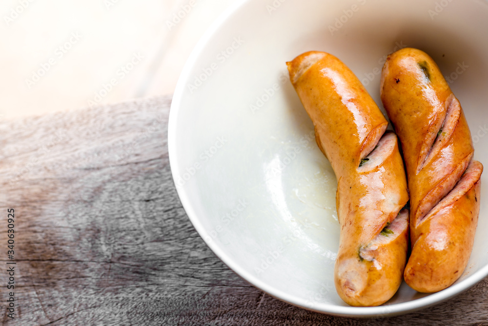 background of the delicious sausages, which are fried or grilled and put on a plate for sale to customers background of the delicious sausages, which are fried or grilled and put on a plate for sale to customers
