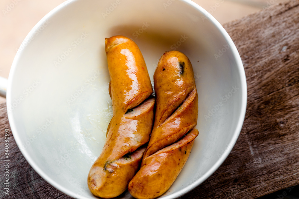 background of the delicious sausages, which are fried or grilled and put on a plate for sale to customers background of the delicious sausages, which are fried or grilled and put on a plate for sale to customers