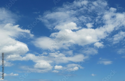 Beautiful fluffy clouds in blue sky  natural background