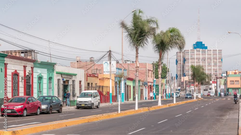 Monumental Callao is one of the new fashion areas near Lima timelapse. Gamara street traffic with colorful houses and restaurants. Lima Peru. Monumental Callao is one of the new fashion areas near Lima timelapse. Gamara street traffic with colorful houses and restaurants. Lima Peru.