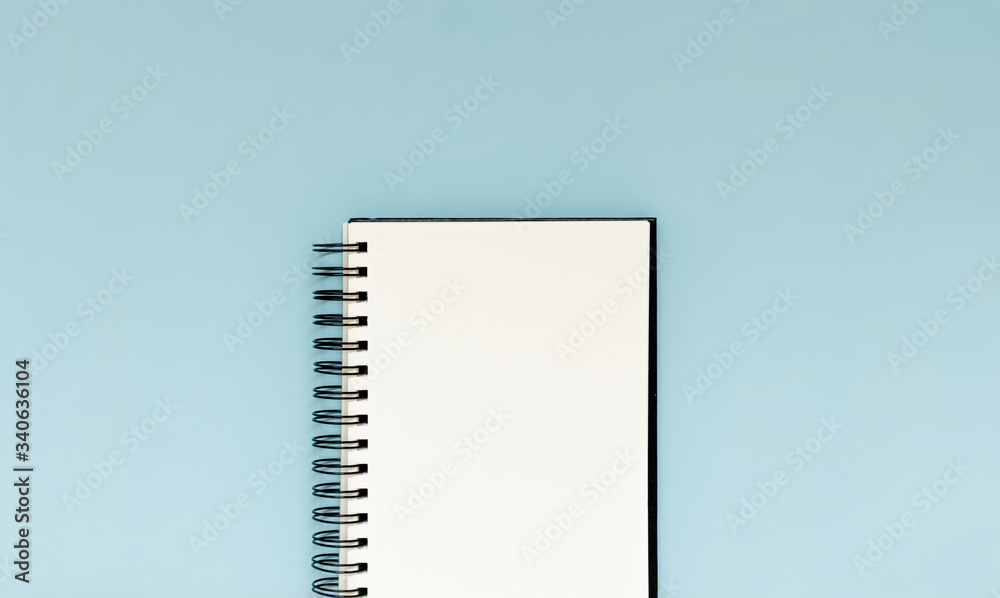 White blank notebook to plan future goals, challenges and achievements. Flay lay perspective with copy space White blank notebook to plan future goals, challenges and achievements. Flay lay perspective with copy space