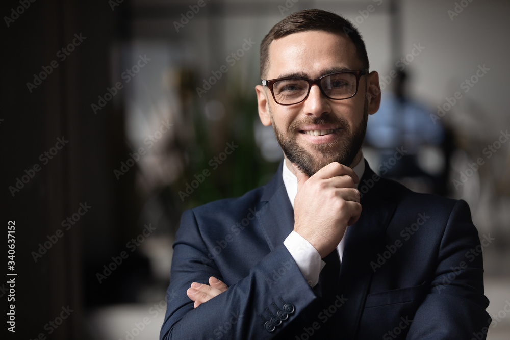 Headshot portrait of smiling middle-aged caucasian businessman in glasses look at camera with confidence, happy male boss or director in spectacles posing for picture at office, leadership concept Headshot portrait of smiling middle-aged caucasian businessman in glasses look at camera with confidence, happy male boss or director in spectacles posing for picture at office, leadership concept