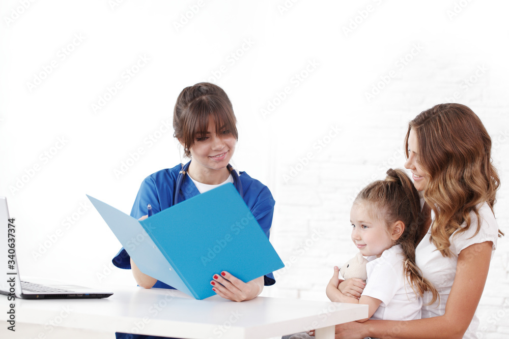 Pediatrician doctor writing prescription Pediatrician doctor writing prescription