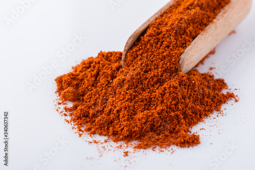 aromatic spicy chili powder on a white background
