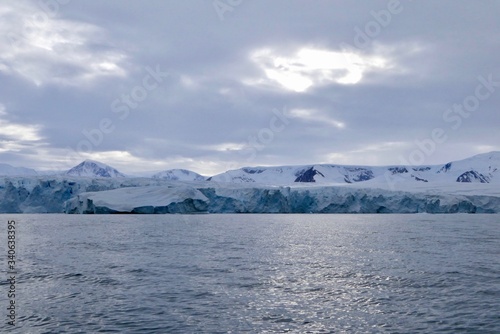 Wallpaper Mural Glacier front in antarctic sea with cloudy sky, dark ocean, Antarctica Torontodigital.ca