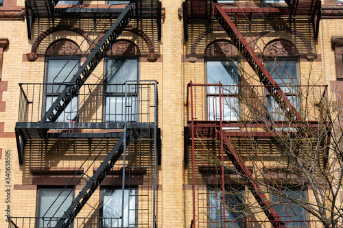 Wallpaper Mural Beautiful Old Apartment Building Exterior with Fire Escapes in New York City Torontodigital.ca