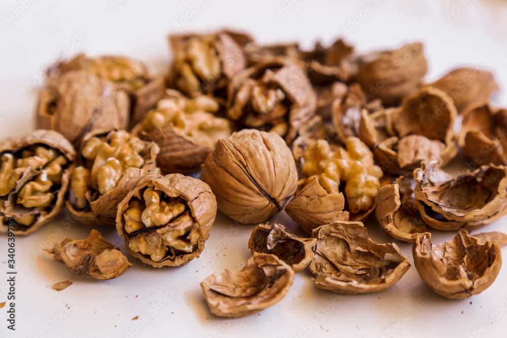 pilled walnut isolated on white background. Composition from nuts on the white isolated background pilled walnut isolated on white background. Composition from nuts on the white isolated background