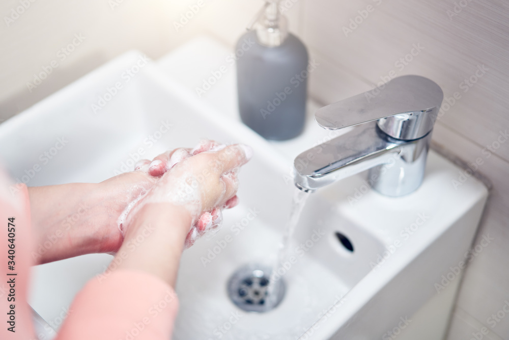 Washing of hands with soap under water