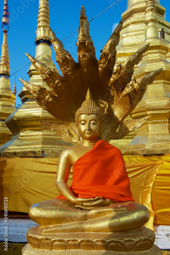 Buddha statue in red at Wat Boromthat temple in Tak, Thailand. photo