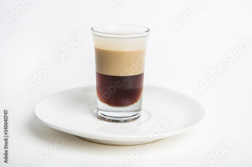 a shot of dark brown cocktail drink called B52