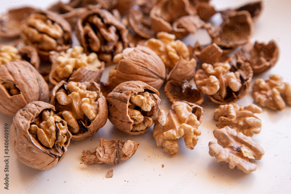 pilled walnut isolated on white background. Composition from nuts on the white isolated background pilled walnut isolated on white background. Composition from nuts on the white isolated background