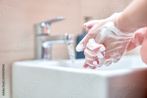 Washing of hands with soap under water