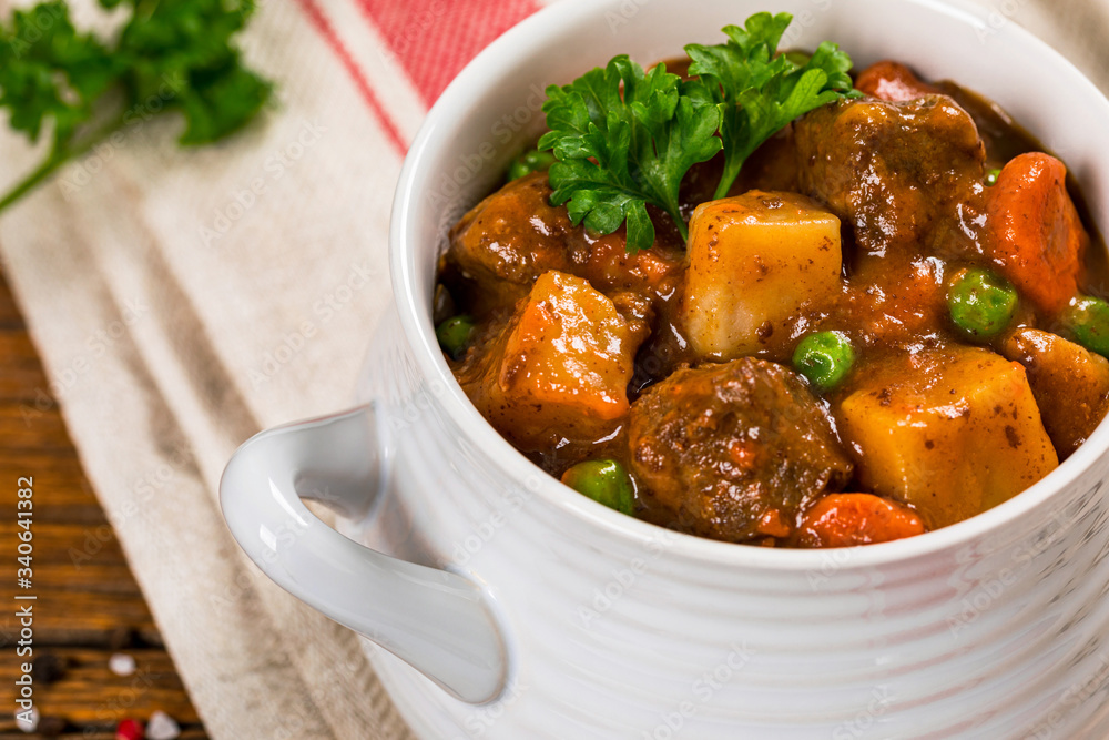 Beef Stew with Potatoes and Carrots made in a Slow Cooker. Selective focus. Beef Stew with Potatoes and Carrots made in a Slow Cooker. Selective focus.