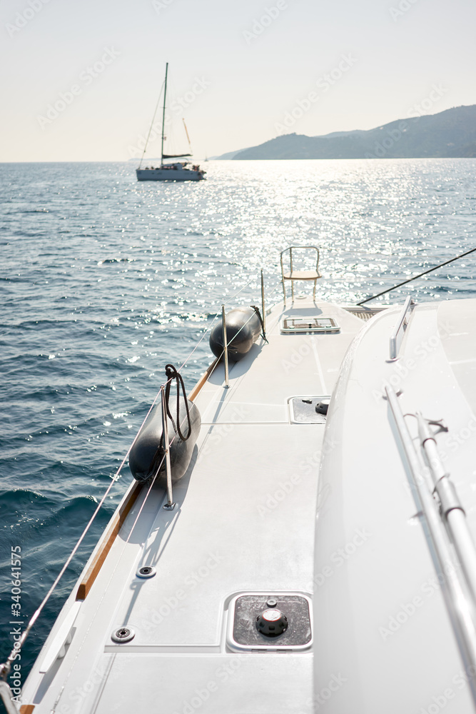 Fototapeta premium Catamaran and yacht in the sea, background. Vacation concept.