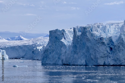 Glacier front in antarctic sea, Antarctica, blue sky, Stonington Island