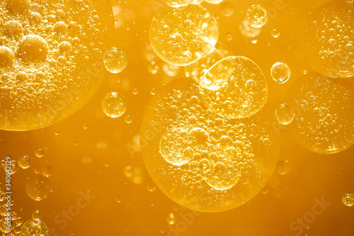 golden yellow bubble oil droplet, abstract background photo