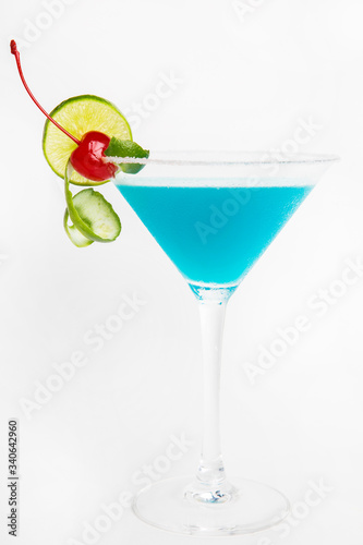blue lagoon cocktail decorated with lime fresh cocktail with blue curacao or blue hawaiian alcohol  