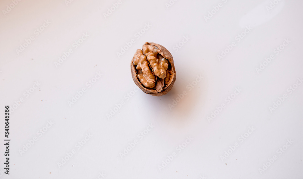 pilled walnut isolated on white background. Composition from nuts on the white isolated background pilled walnut isolated on white background. Composition from nuts on the white isolated background