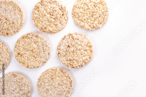 Puffed rice cakes on white background. Flat lay, top view. Rice waffle. copy space