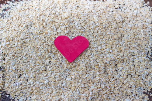 red heart on spilled oats