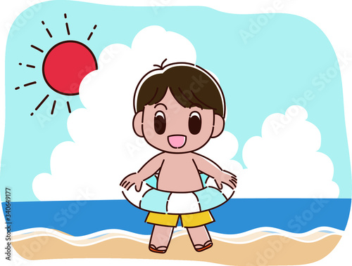 海で浮き輪をもつ水着の男の子