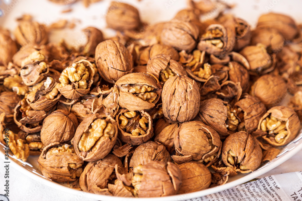 pilled walnut isolated on white background. Composition from nuts on the white isolated background pilled walnut isolated on white background. Composition from nuts on the white isolated background