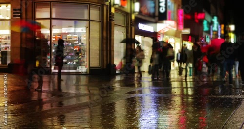 Shopping street full of people at night