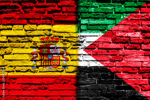 Flag of Spain and Palestine a on brick wall