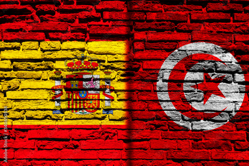Fototapeta premium Flag of Spain and Tunisia on brick wall