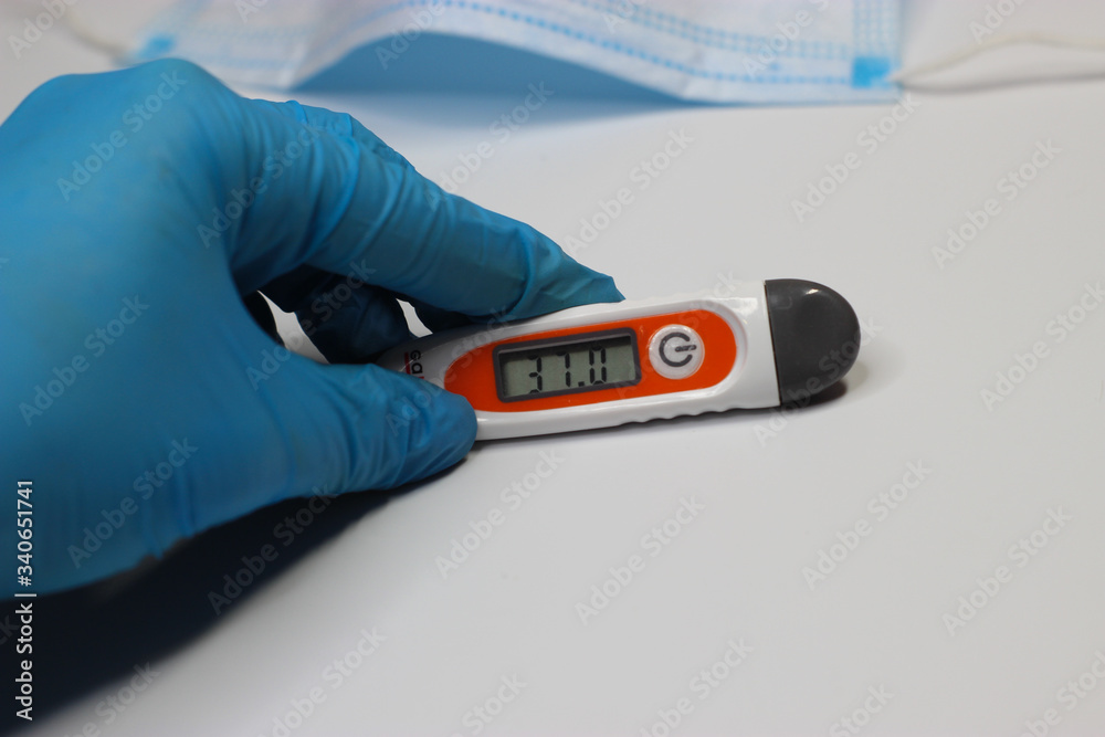 Obraz premium hand with a thermometer