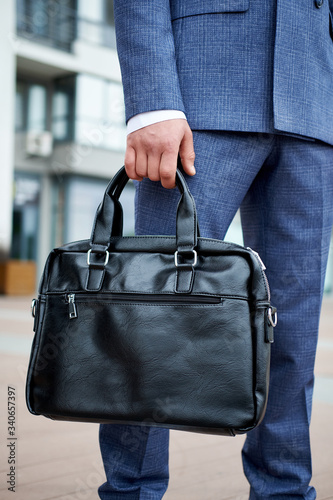 Businessman style. Men style. Young businessman with bag
