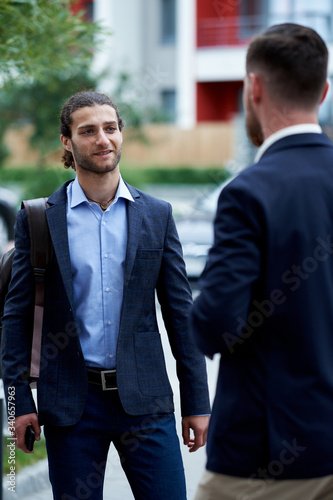 Business men shaking hands, starting up a meeting. Elegancy and male style