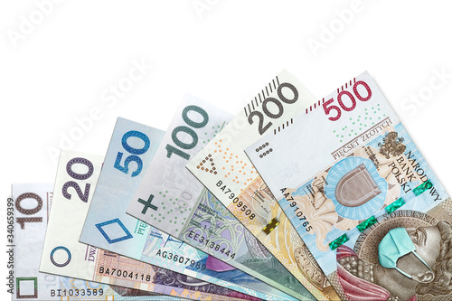 All Polish banknotes with face mask against Coronavirus which hit Polish economy causing recession and bankruptcy of thousands of companies. Copy space white background for text 