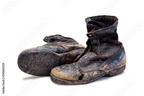 Old and torn boots isolated on a white background {clipping paths}