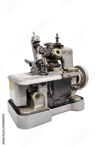 Closeup details on sewing machine overlock. Workplace seamstress. Tailoring industry
