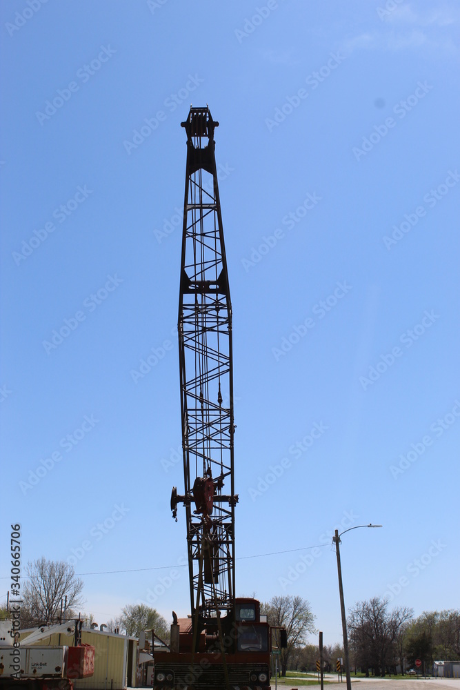 Construction crane arm sitting along side of road Construction crane arm sitting along side of road