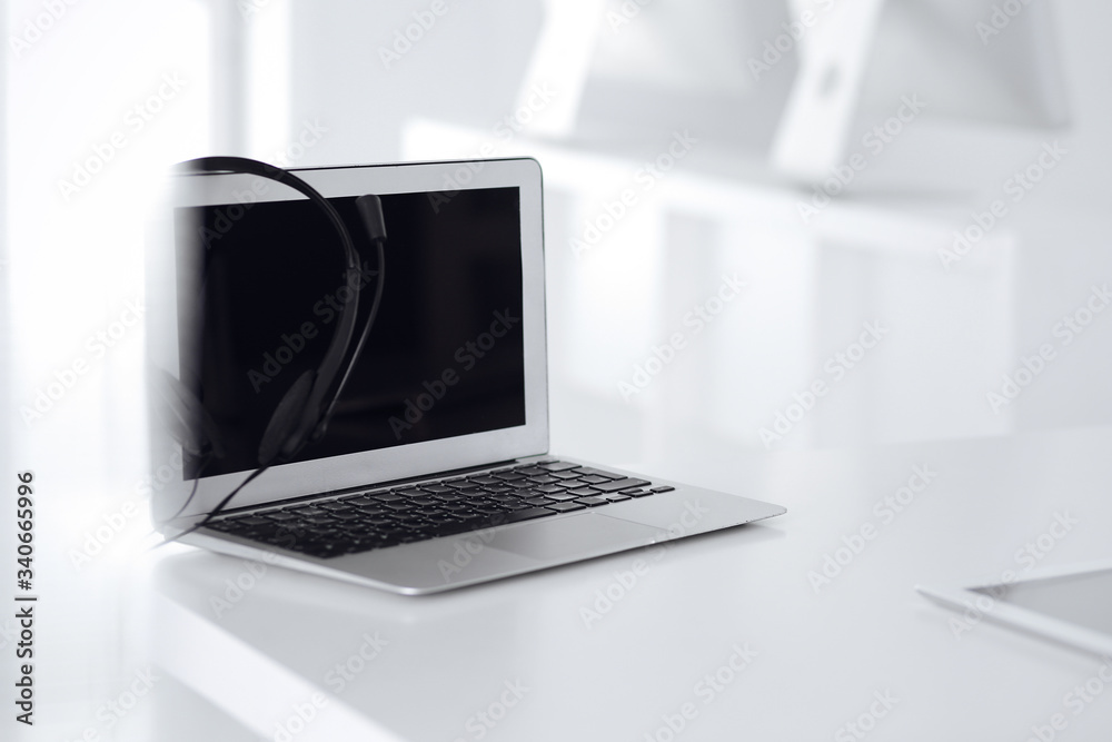 Fototapeta premium Call center and communication support, customer service help desk. VOIP headset on laptop computer