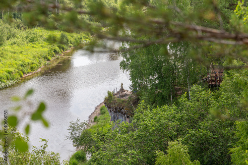 Statue of the angel of one hope. Serga river in Deer streams national Park. Sverdlovsk region, Ural, Russia.