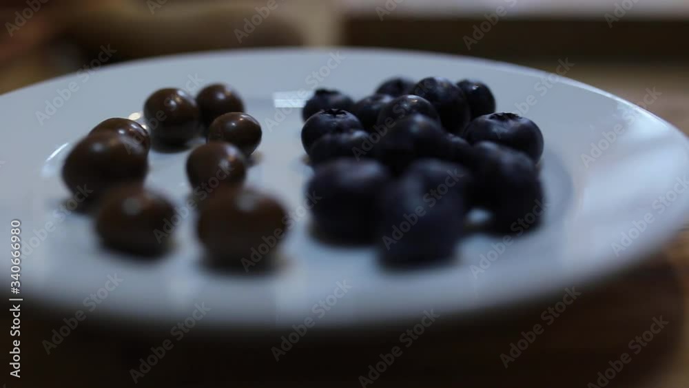 Pancake ingredients. Blackberries and chocolate chip on a white plate. Pancake ingredients. Blackberries and chocolate chip on a white plate.